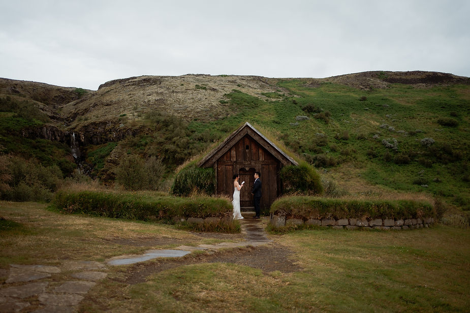 adventure wedding in iceland in front of a turf house